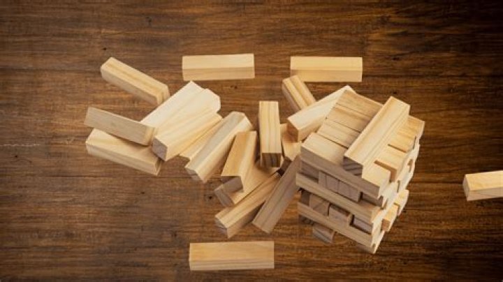 Can you touch more than one block at a time in Jenga?